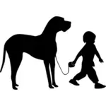 Boy walking dog