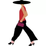 Donna alla moda che cammina