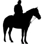 Homem na silhueta a cavalo