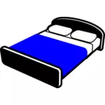 Bed met blauwe deken