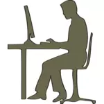 Silhouette of man sitting at computer desk vector clip art