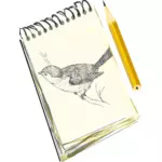 Bloco de notas num bloco de desenho de um pássaro