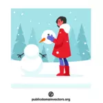 Girl making a snowman