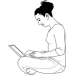 Tyttö kannettavan tietokoneen kanssa