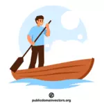Cara feliz remando um barco