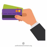 Kartu kredit memegang tangan