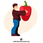 Mannen håller i en enorm paprika