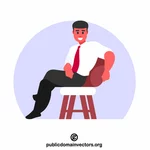 Расслабленный мужчина в кресле