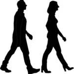 男性と女性のシルエットを歩く
