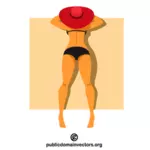 Wanita dengan topi merah berjemur